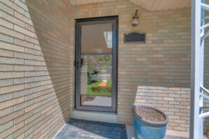 Front door of house with glass storm door