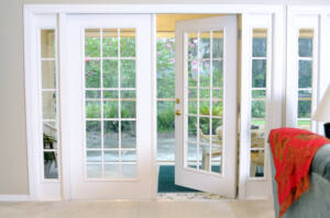 Open white French patio doors with garden in back