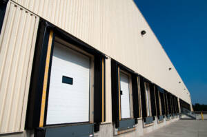 Row of closed loading bay doors at a warehouse