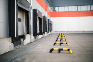 Warehouse exterior with several loading docks with dock shelters